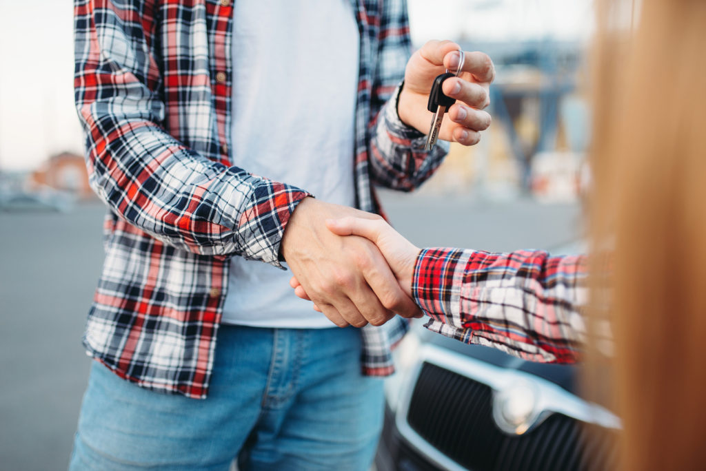 Driving instructor gives car key to female student