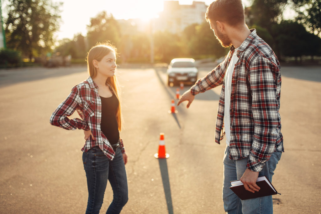 Male instructor and female student, defensive driving school