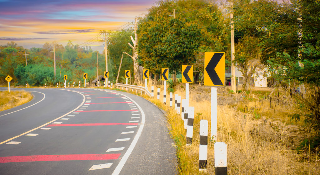 Signal turn left on country road