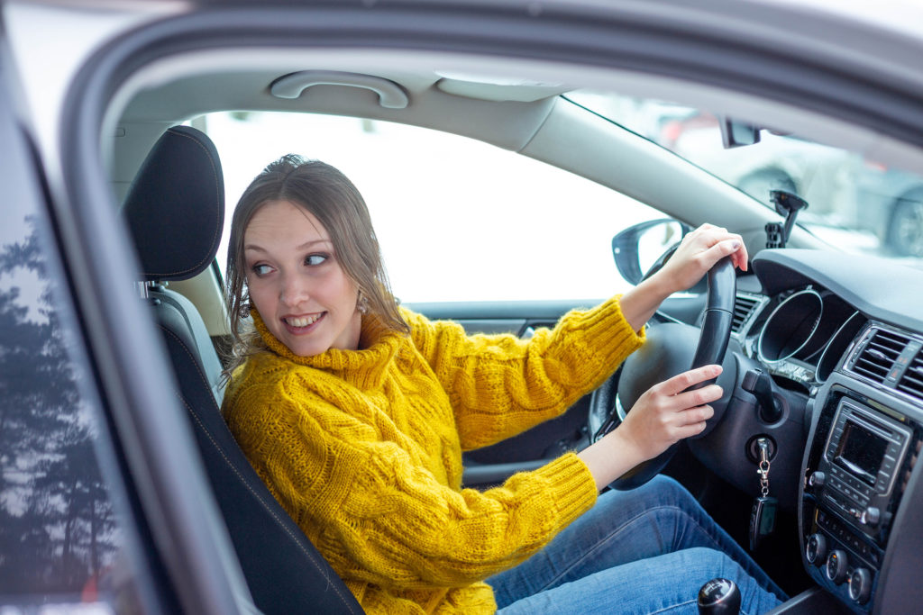 Woman parallel parking a car or just going backwards